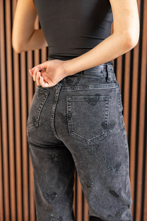 Pantalon recto negro con brillos de corazones vista trasera lateral