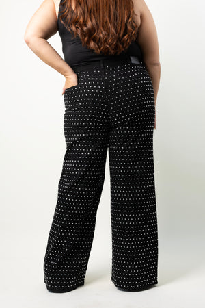 Vista trasera del pantalon wide leg curvy negro con brillos para mujer.