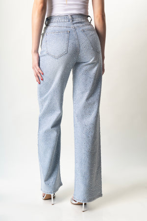 Vista trasera del pantalon wide leg azul con brillos y bolsillos traseros.